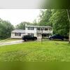 The homeowner was contending with old, worn-out siding, rotted porch columns, a dilapidated door, and outdated siding and brick. To exacerbate matters, the failing portico posed a safety hazard and detracted from the home's overall aesthetic.