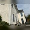 This home needed new windows and siding due to rotting wood beneath the stucco.