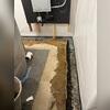 Laying the groundwork for long-term basement protection with a meticulously placed WaterGuard system.