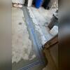 TrenchDrain was installed inside of the garage door to catch excess and surface water during heavy rains. It is connected to the SuperSump Plus sump pump.