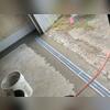We put a trench drain in the garage door so all water can be collected into the subfloor drainage system.