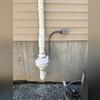 Completed system with a premium radon mitigation fan and required electrical disconnect.
