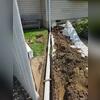 Installing the exterior piping to handle water safely and efficiently, protecting the foundation from excess moisture.