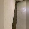This completed installation intercepts groundwater before it can enter the basement. WaterGuard works in tandem with the sump pump to keep the space dry and protected.