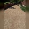 Power washing transformed the stained, gray concrete, revealing its original caramel color and restoring its natural appearance.