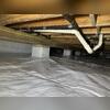 We wrap the piers with Wallie to prevent condensation from entering the crawl space through the porous concrete.