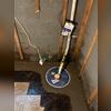 The system is in place and operational, keeping the basement dry even during heavy rain. This sump pump works with the drainage system for total water management.