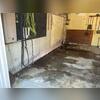 The garage foundation wall had experienced inward movement, resulting in a structural crack. This breach allowed water intrusion, leading to persistent moisture issues within the garage.