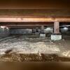 This photo shows the condition of a crawl space before encapsulation services were completed in Encinitas. Exposed soil, moisture-prone conditions, and unprotected crawl space areas can contribute to humidity buildup, musty odors, mold growth, wood deterioration, and poor indoor air quality. Saber...