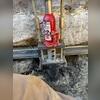 Helical Pier lifting a foundation