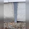 Although the separation at the crack was significantly reduced following push pier installation, a professional crack sealant was applied to fully seal the joint. This repair prevents moisture intrusion into the foundation while providing additional reinforcement to the affected area, further...