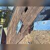 The original shingles are gone, and we are inspecting the decking for rot and water damage.