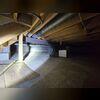 Weak beams in this crawl space were causing floors to sag in the home.