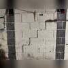 Large cracks along the block walls raised concerns about structural movement.