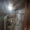 In the corner, you can see our TripleSafe installed with two discharge pipes to remove up to 6,400 gallons of water per hour out of the basement.