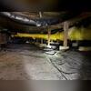 In this photo, you can see a dirty vapor barrier, and hanging insulation, which are both highly indicative of water intrusion.