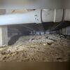 Standing moisture and debris highlight why encapsulation is needed for this space.