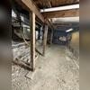 Moisture has warped the wood support structures of this home, and more damage was coming.