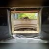 The crew frames the crawl space access to allow the door to seal properly.