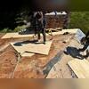 The team replaces rotted and worn decking