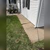This sidewalk has settled, causing the large crack and unlevel concrete.