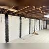 These high-strength carbon fiber straps are anchored to the wall and work to reinforce against bowing or cracking without the need for excavation.