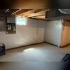 Our WaterGuard subfloor drains were installed underneath the floor around the perimeter of the basement. The vapor barrier was tucked into the WaterGuard wall flange as well. We concealed the drainage system by floating a fresh concrete layer over the top of it.