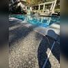 Subsurface voids beneath the pool deck compromised the soil support, resulting in settlement of the concrete slabs to elevations below the pool coping.