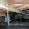 These bottlejacks were sinking and rusting away, leaving the floor joists unsupported in areas. This photo was taken before installation.