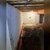 A drainage system was installed around the perimeter of the crawl space to direct intruding water towards the sump pump for removal.