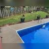 After repairs were completed, the pool deck had a cleaner, more even appearance with improved support beneath the concrete.