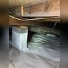Wallie is secured to the porous concrete piers to help eliminate a source of moisture in the crawl space, condensation.