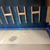 This basement wall is shown before waterproofing repairs were completed. Signs of moisture intrusion are visible along the wall and floor joint, highlighting the areas that would later be sealed and protected as part of the waterproofing system installation.