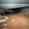 Visible puddling and sagging areas indicate long-term water and support issues.