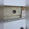 When insulating an exterior wall, RetroFoam is installed beneath the siding. To do this we remove a piece of siding and cut out a small hole to access the wall cavity.