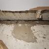 First image of the project showing a basement affected by water seepage, visible moisture, and signs of water on the floor and foundation walls. This situation indicates a problem with inadequate drainage and a risk of structural damage as well as mold growth.