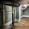 We ran our PowerBraces from the footing (beneath the floor) to the floor joist system in the ceiling. Our PowerBraces help dissipate the weight of the soil evenly across the wall to stop the wall from shifting in the middle. If you look at the brace in the center of this photo, up towards the top...