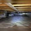 A CleanSpace vapor barrier was installed throughout the crawl space, with the support piers fully wrapped and the walls insulated with SilverGlo insulation panels. Drainage matting was installed beneath the vapor barrier to separate the CleanSpace liner from the soil and promote proper drainage. A...