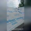 Herer we have removed the storm-damaged shingles and started protecting the roof's decking with underlayment.