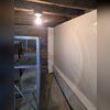 Weak beams in this home were causing the floors up above them to sag.