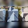 Aerial view of the completed roof shows the full transformation, with IKO Dynasty Atlantic Blue shingles installed across every roof plane for a sharper look and stronger protection.