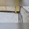 Up close, you can see how far this slab has sunk. It should sit right below the tile.