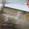 A visible crack in the foundation was present before work began, indicating settlement and structural movement. This issue required stabilization to prevent further damage and ensure the home's stability.