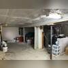 The existing temporary lally columns and split wooden support posts had experienced structural deterioration and were unable to adequately transfer imposed loads to the foundation. This loss of support contributed to floor settlement, sagging, and increased floor bounce.