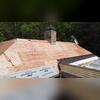 After tear-off, damaged or weak decking was replaced so the new IKO Dynasty Shadow Brown shingle system would have a solid surface underneath.
