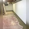 As water seeps through the walls, it's discreetly directed down behind the BrightWall and into the WaterGuard drainage system running along the entire basement perimeter. Now, moisture doesn't stand a chance in Lynette's basement anymore!