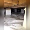 We wrap the piers with Wallie. It prevents condensation from the porous concrete blocks from entering the crawl space.