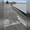 Once the membrane is stretched to a certain point, it is well beyond repair. A new flat roof membrane and underlayment will need to be installed to fix the damaged flat roof.