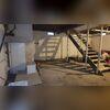 The stains on the concrete walls and floor of this basement were a sign that water was making its way through.