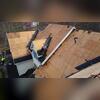 Once the old shingles are stripped away, the crew can see the condition of the plywood underneath and address any weak areas before rebuilding.